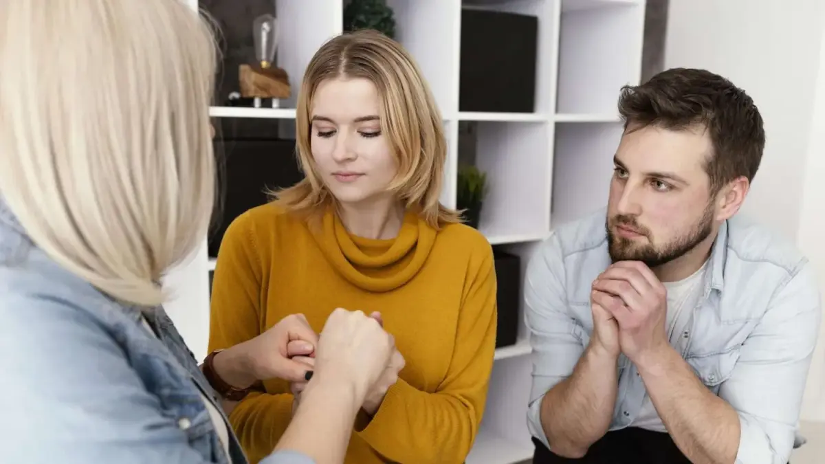 women holding hands therapy session 2