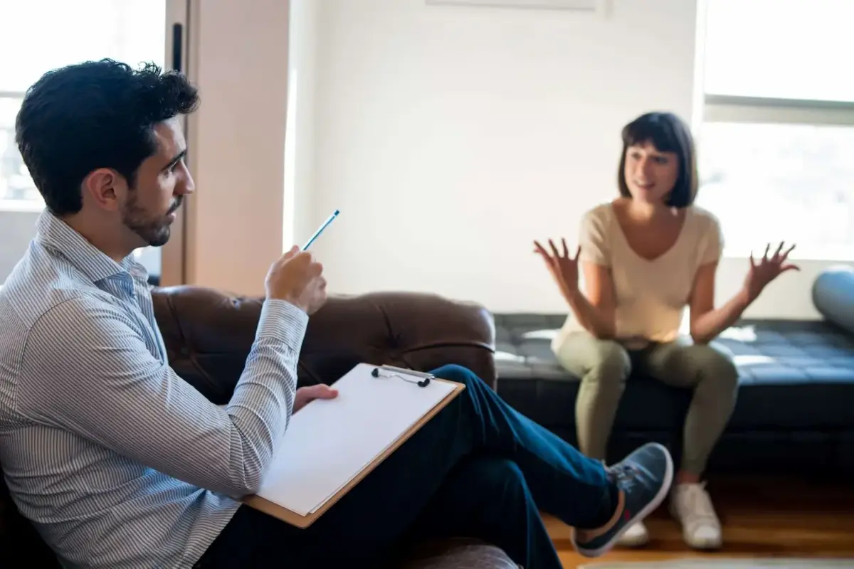 A therapist explains the stages of addiction to a patient