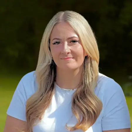 Portrait photo of Danielle Dyas, Staff Nurse, at Smarmore Castle taken outside in the sunshine