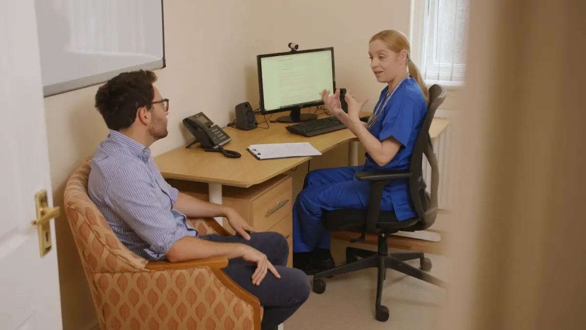A nurse explains detox from drugs and alcohol to a patient during addiction rehab