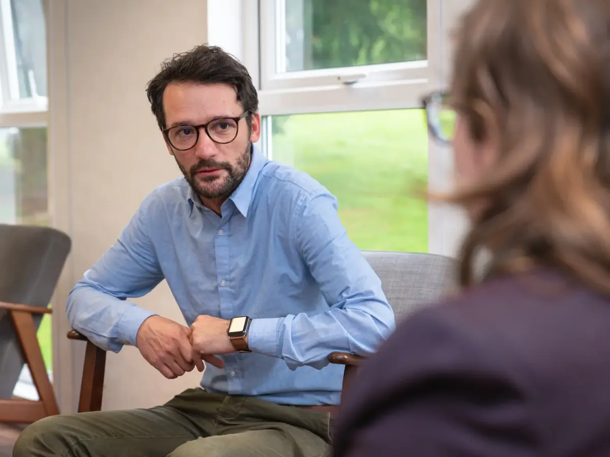 A photo of a man during an addiction therapy session during rehab at Smarmore Castle in Ireland